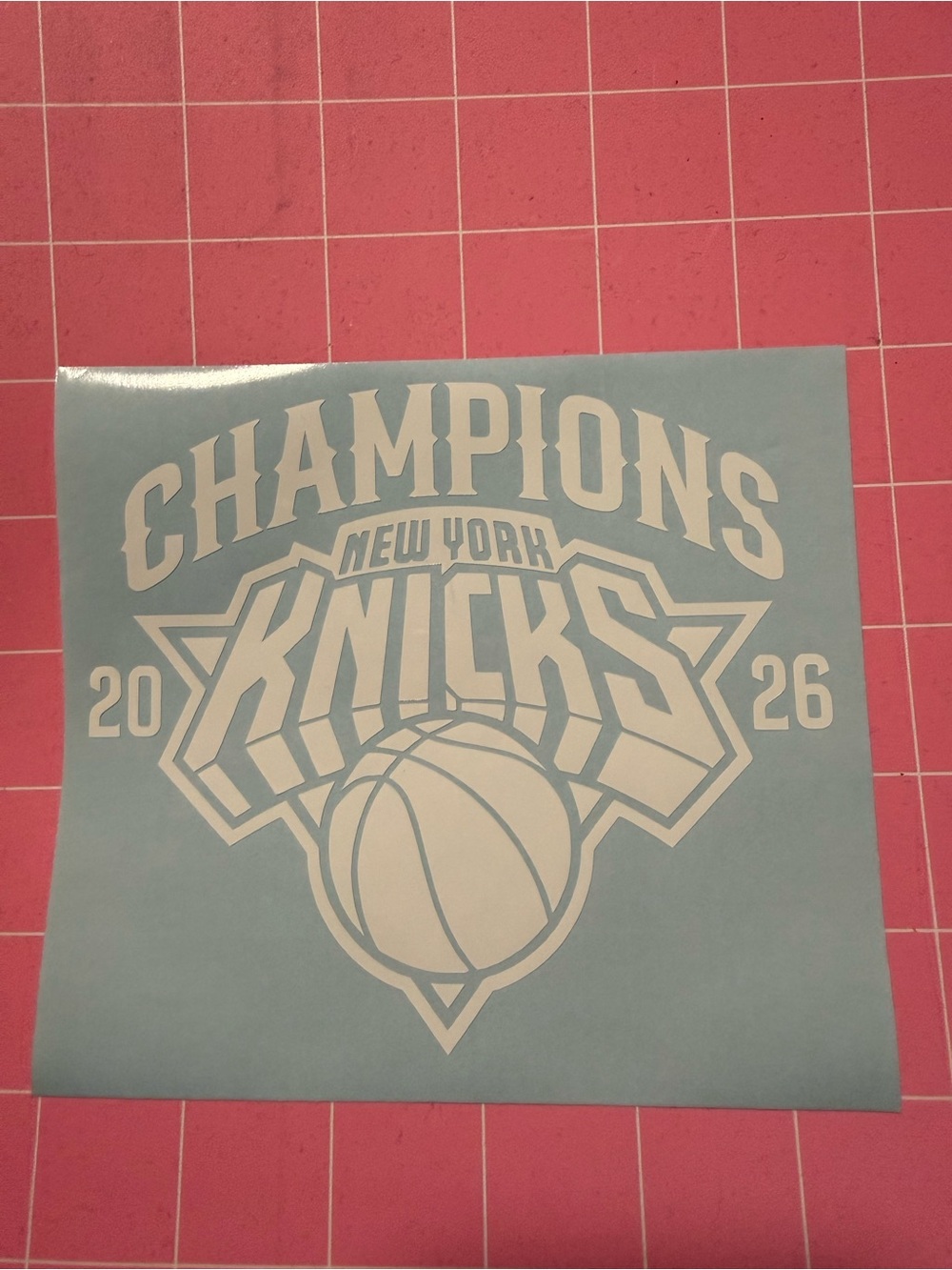 New York Knicks 'Champions 2026' White Vinyl Decal on Light Blue